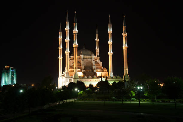 istock The view mosque and park at night, city background. 1065143340