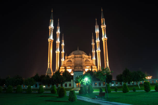 istock The view mosque and park at night, city background. 1065145378