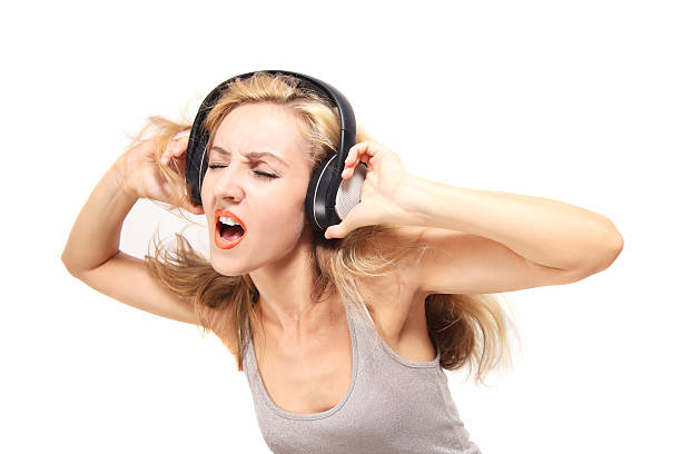 istock young woman singing with headphones 106514616