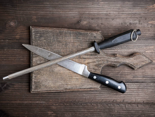 istock old brown wooden cutting board and knife with sharpening 1065146466