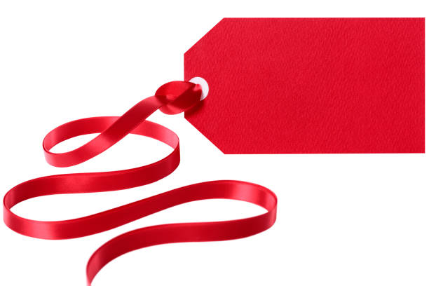 istock Red gift tag label with ribbon isolated white 1065146582