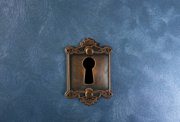 Vintage lock on blue Retro lock on blue textured background keyhole photos stock pictures, royalty-free photos & images