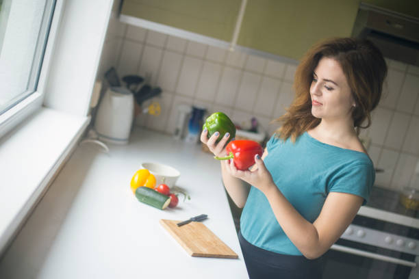 istock Young woman cooking 1065151582