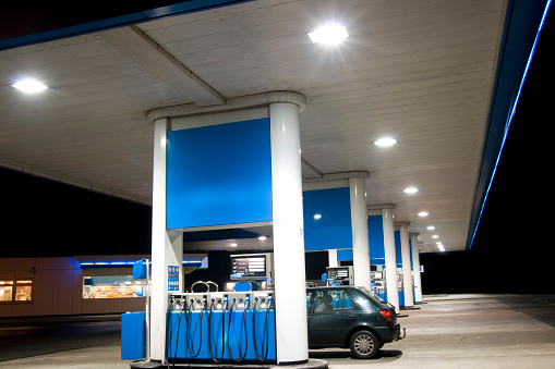 Blue petrol station at night