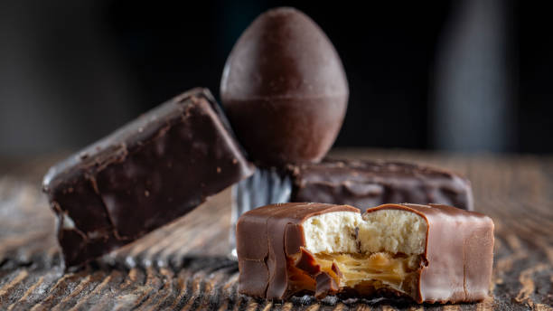 istock Chocolate candies on a wooden background. Close-up 1065154560