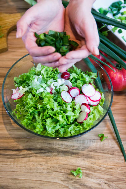istock fresh salad with radishes, lettuce and onions 1065157716
