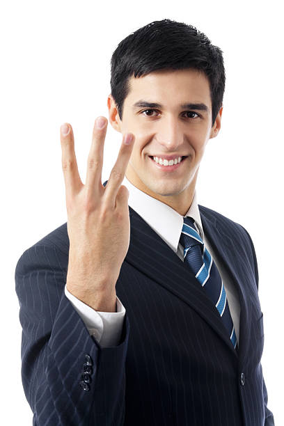Happy businessman showing three fingers, isolated on white stock photo