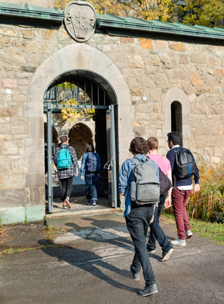 istock Small group of students going in College University entrance. 1065163214