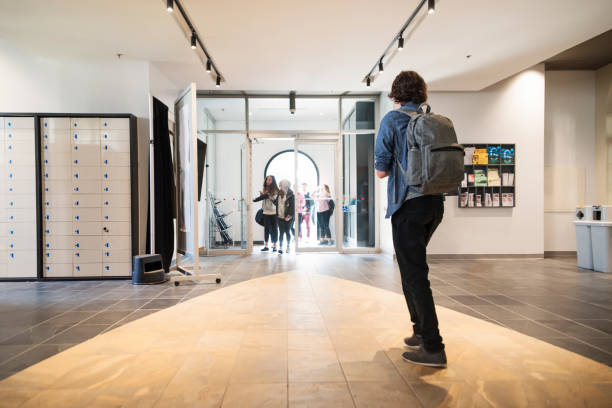 istock Small group of students going in and out College University lobby. 1065163282