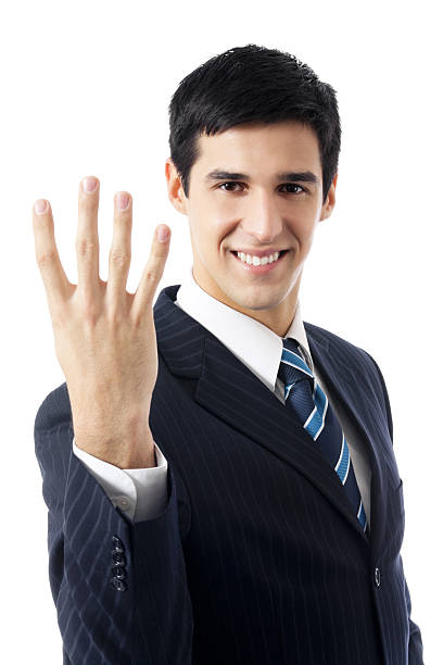 Happy businessman showing four fingers, isolated on white stock photo