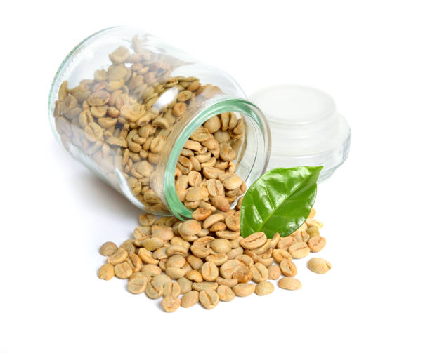 istock Green coffee beans isolated on white background 1065164380