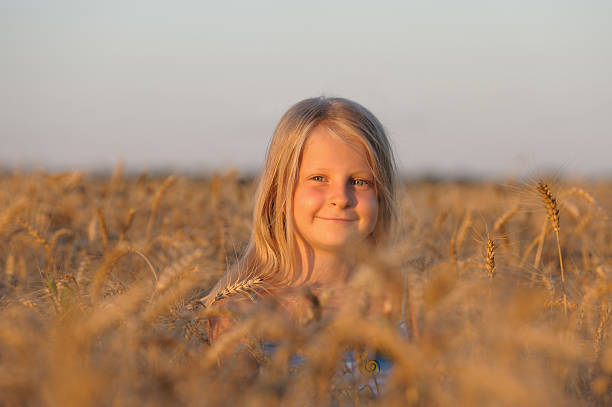 istock The girl in filed wheats. 106516902