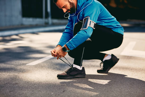 istock Male runner tying shoelace. 1065172994