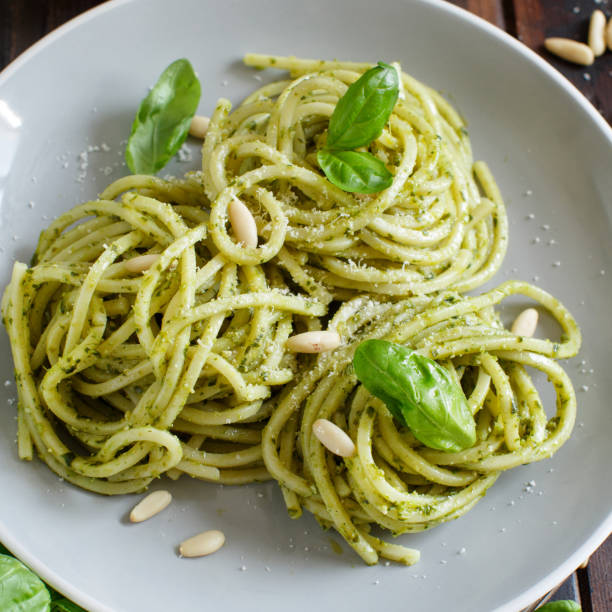 istock Spaghetti pasta with pesto sauce 1065175250