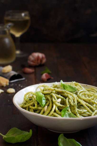 istock Spaghetti pasta with pesto sauce 1065175258
