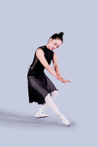 istock Ballerina dancing in the studio 1065175786