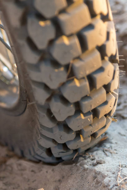 istock Motorcycle wheel on a sandy road, close-up 1065176084