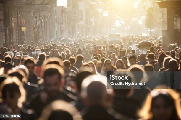 Blurred Crowd Of Unrecognizable At The Street Stock Photo - Download Image Now - Crowd of People, People, Crowded