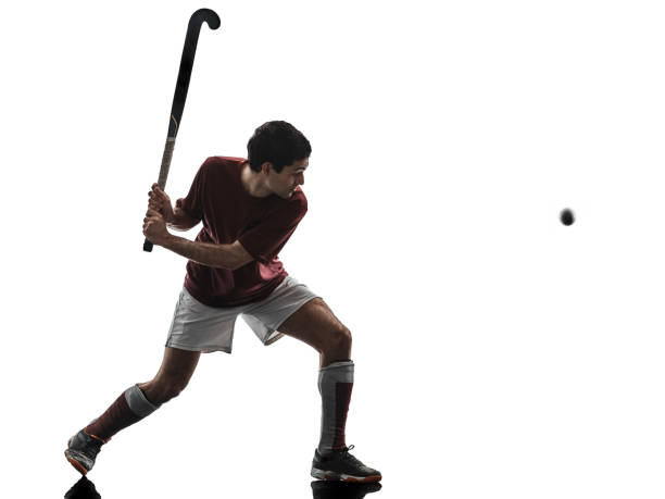 istock field hockey player man isolated silhouette white background 1065185822