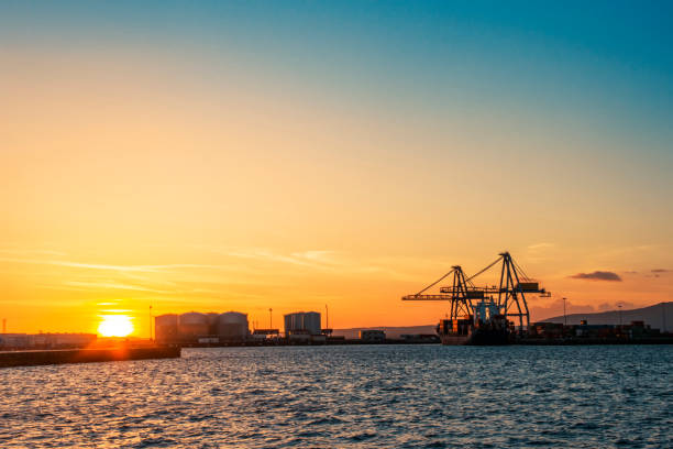 istock Commercial harbor at sunset 1065186350