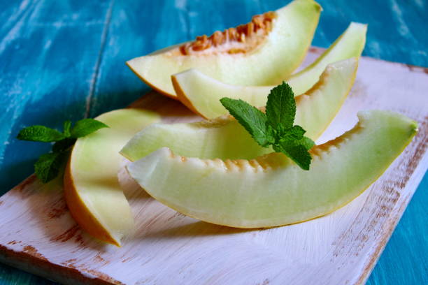 istock Fresh melon slice on the wooden table. 1065196638