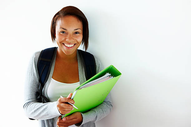 portrait of cute young female student isolated on white background  teenage girls pretty smile looking at camera waist up stock pictures, royalty-free photos & images