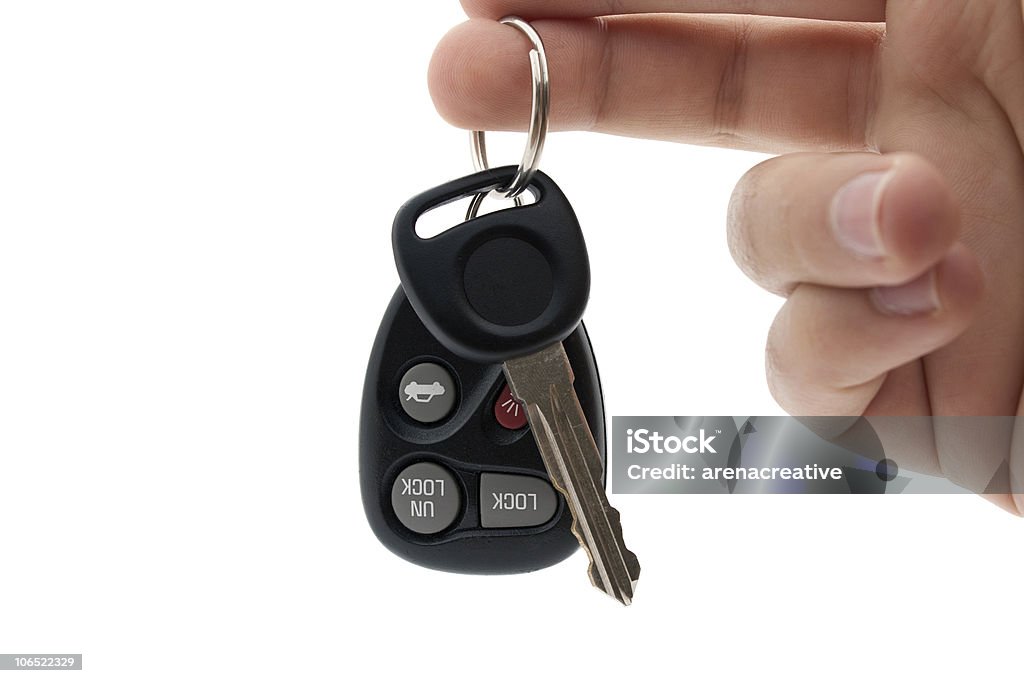 Remoto y las llaves del automóvil - Foto de stock de Mano humana libre de derechos