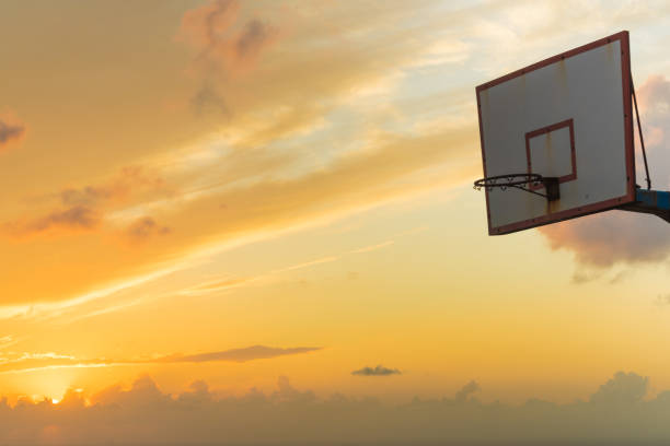 istock basketball basket against sunset sky 1065225680