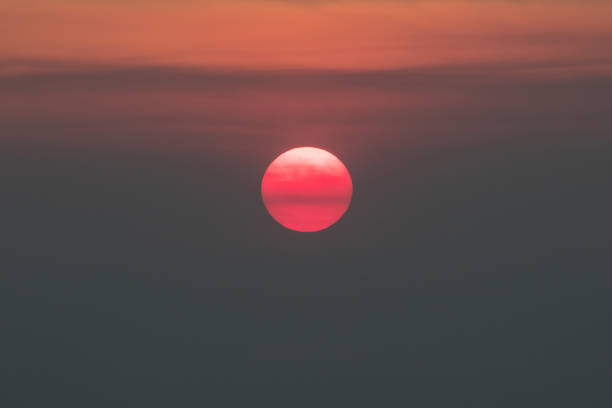 Gorgeous Sunset Due to Smoke from Wildfire Smoke from a wildfire obscures the late afternoon sun in the San Francisco Bay Area of northern California. Wildfires are becoming more common all over the west coast due to climate change. forest fire photos stock pictures, royalty-free photos & images
