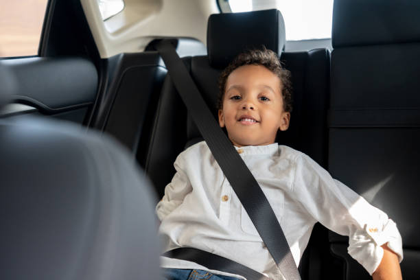 istock Happy boy in a car with his seat belt fastened 1065238442