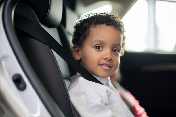 istock Happy boy in a car with his seat belt fastened 1065238532