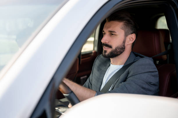 istock Happy man at a car dealership going for a test drive 1065238570