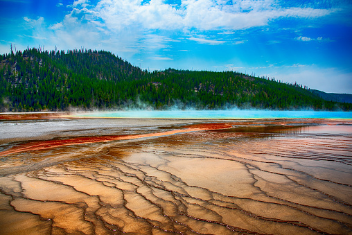 Located in Yellowstone National Park, Wyoming, the largest hot spring in the United States and third largest in the world.  The amazing colors are actually varying species of heat loving microbes in the pools - each having a different color and existing at a different temperature.