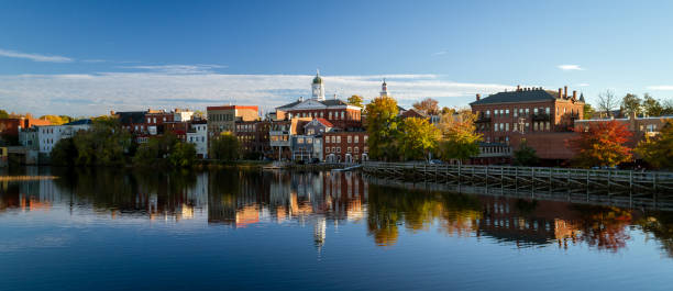 istock The river front buildings are seen reflected in the water 1065254888