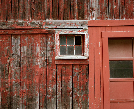 Old western rustic wooden style exterior wall with a framed window