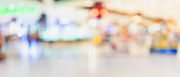 istock Blurred image of interior in shopping mall for background. 1065259752