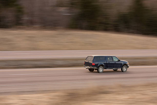 istock Speeding Blue Pickup truck 106526525