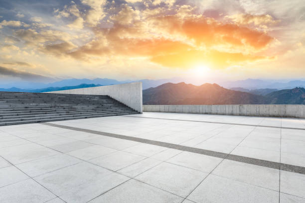 istock Empty floor and green mountain with beautiful clouds at sunset 1065266398