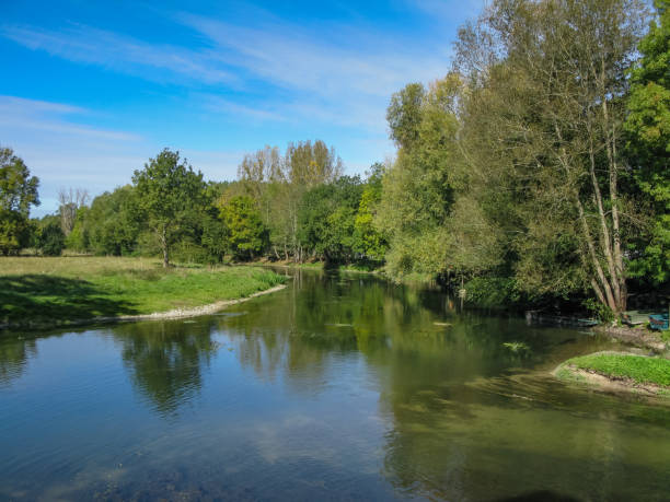 istock trees and grass on the canal in the Loire 1065270660