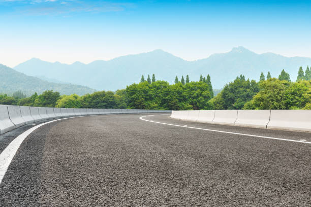 istock Asphalt road and green mountains 1065271590