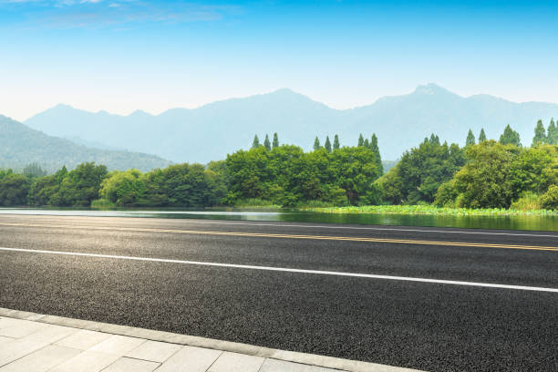 istock Empty asphalt road and green mountains 1065274614