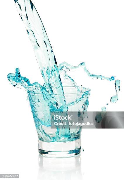 Glass With Splashing Blue Drink Stock Photo - Download Image Now - Alcohol - Drink, Blue, Cocktail