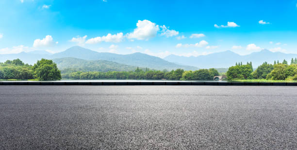 istock Asphalt road and green mountains 1065275924