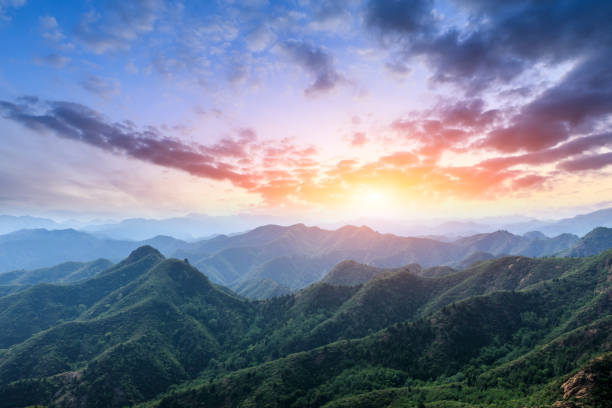 istock Green mountain and beautiful cloud at sunset 1065275928