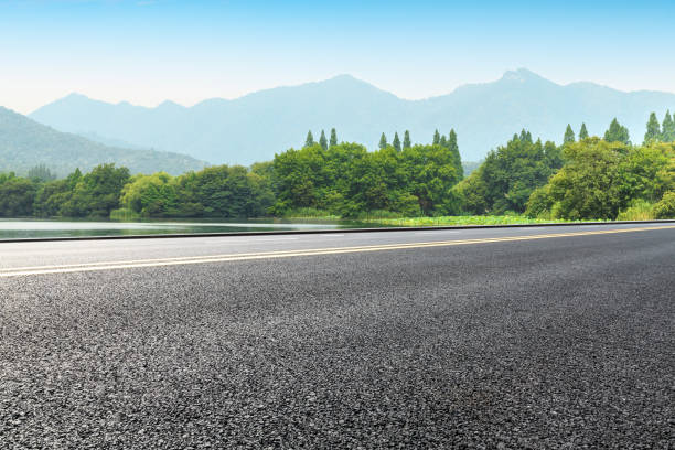 istock Empty asphalt road and green mountains 1065275934