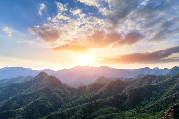 istock Green mountain and beautiful cloud at sunset 1065276022