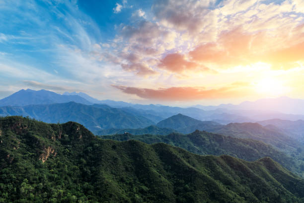 istock Green mountain and beautiful cloud at sunset 1065276062