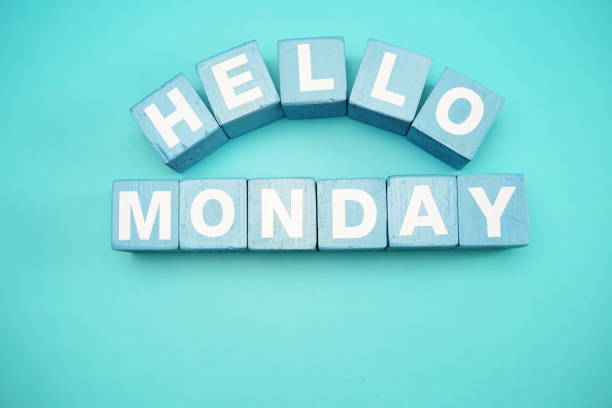 istock hello monday with blue wooden cubes alphabet letter on blue background 1065276156