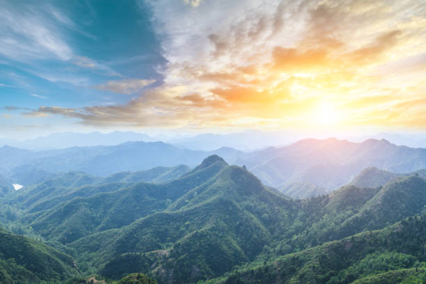 istock Green mountain and beautiful cloud at sunset 1065276192