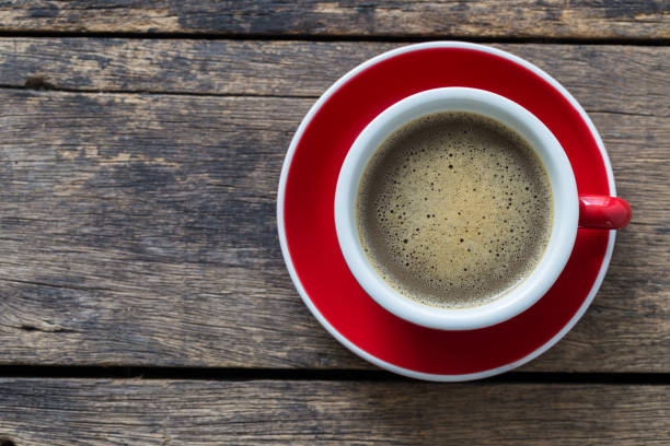 istock Red Coffee Cup and coffee bean on wooden background 1065277906